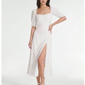 Cottage white dress by Commense with a side split